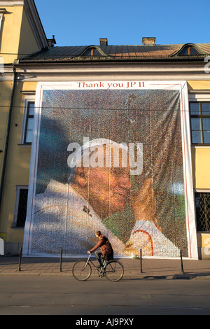 Poland Krakow Cracow Banner  Pope John ll image made from individual photographs.Banner hanging on the facade of Bishop's Palace Stock Photo