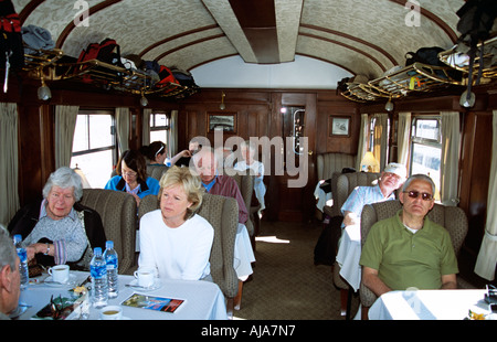 Passengers in luxurious carriage of Puno to Cusco Perurail train journey, Peru Stock Photo
