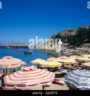 Sunshades On St. Pauls Bay Lindos Rhodes Greek Islands Greece Hellas Stock Photo