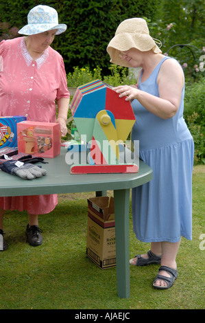 Women running a fete tombola stall, Oxfordshire, UK Stock Photo