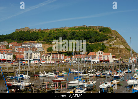 Yatchs moored in the harbour below the castle Scarborough North Yorkshire England Stock Photo