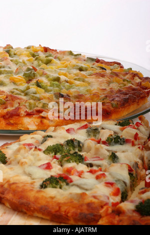 Vegetarian pizza on a plate cheese vegetable fast food photography nobody photo close up overhead view from above in USA US vertical hi-res Stock Photo