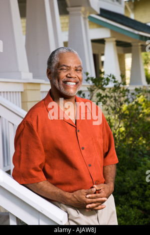 African American middle aged man smiling at viewer Stock Photo