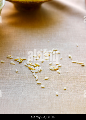 Rice Grains on Brown Background Stock Photo