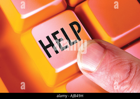 finger on help key button on computer keyboard Stock Photo