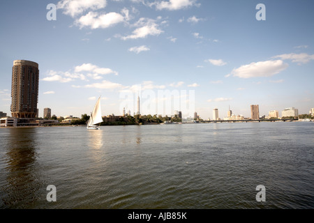 Panorama view north along River Nile towards 6 October Bridge with Felucca sailing boat Cairo Egypt Africa Stock Photo
