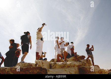 Tourists taking pictures of The Sphinx with blue sky above Giza Cairo Egypt Africa Stock Photo