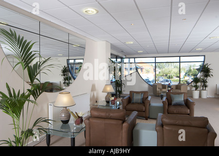 Modern office reception area with chairs and view through window Stock Photo