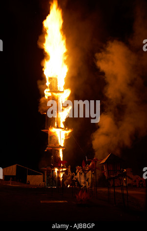 Tower or house of cards catching alight at Fire Event performance at Woodford Folk Festival Queensland Australia Stock Photo