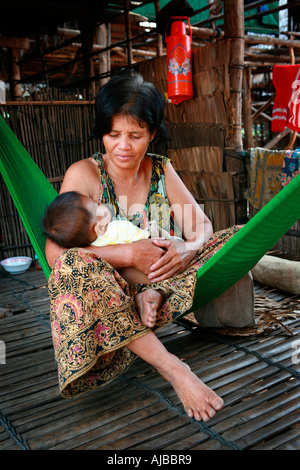 Mother and child at the village of Kompong Phhluk, Tonle Sap, Nr Siem Reap, Cambodia. Stock Photo