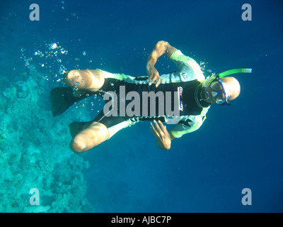 Underwater diving picture of diver in Red Sea at the Canyon dive site near Dahab Sinai Egypt Stock Photo