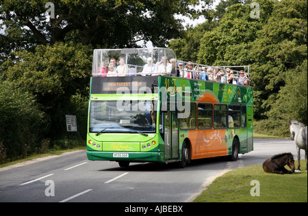 Tour bus turning out of entrance to Beaulieu House in the New Forest Stock Photo