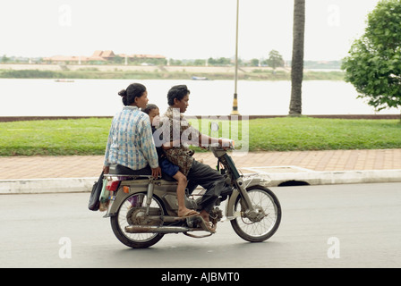 Cambodia Phnom Penh Man Woman And Child Driving On A Motorbike Stock Photo