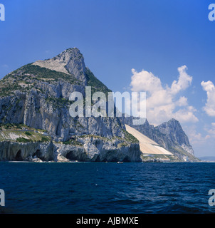 View from the sea of water catchment area steep cliffs against a blue sky showing the dominant majesty of Gibraltar Stock Photo