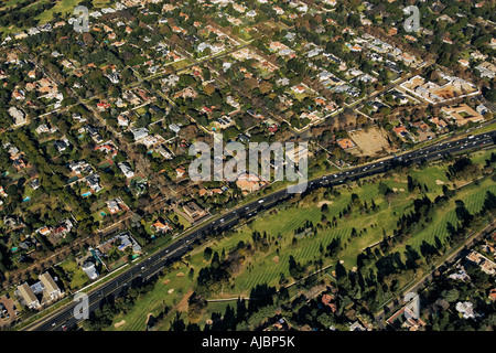 Aerial View of Houses in Suburb and Highway Stock Photo