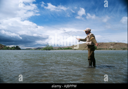 Portrait of a Man Fishing in a River Stock Photo