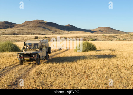 Tourist On Safari in a 4X4Vehicle Stock Photo