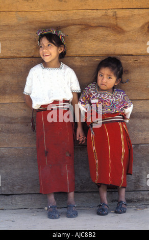 A young ethnic indigenous Ixil Maya woman sitting on a bench with her ...