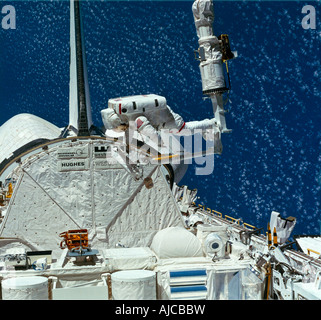 Astronaut Outside Space Shuttle In Holding Bay Stock Photo