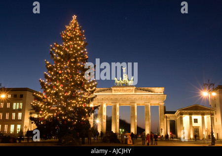 EU DE Germany Capital Berlin A Christmas tree in front of the Brandenburg Gate at the Pariser Platz both illuminated Stock Photo