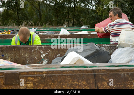 People recycling rubbish at the Civic Amenity Site Skelmersdale Lancashire UK Stock Photo