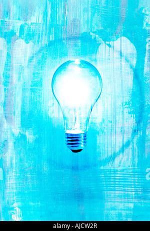 bright light bulb with blue background and circle showing idea or insight Stock Photo