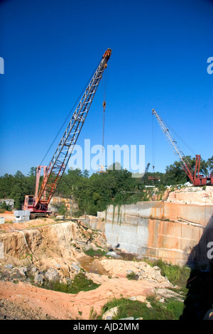 Cranes used for lifting blocks of granite at a quarry in Elberton Georgia Stock Photo