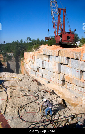 Worker drilling in a granite quarry in Elberton Georgia Stock Photo