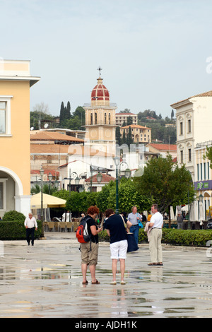 Tourists looking at a map in Solomos Square, Zakynthos town, Greece. Stock Photo
