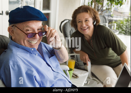 Senior couple relaxing on porch Stock Photo