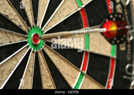 Dart smack in the middle of a bullseye Stock Photo