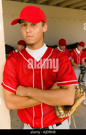 Young baseball player on field, (portrait) Stock Photo