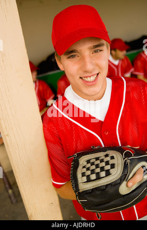 Young baseball player on field, smiling, (portrait), (elevated view) Stock Photo