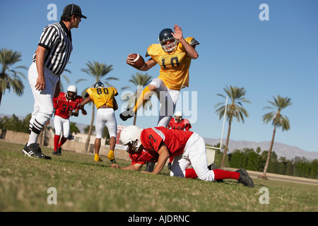 Football players in action on field, ground view Stock Photo