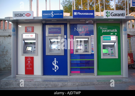 Istanbul Taksim Square line of 4 cash point machines at the bus station early evening Stock Photo