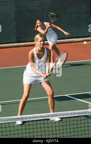 Tennis Player, returning serve in doubles game Stock Photo