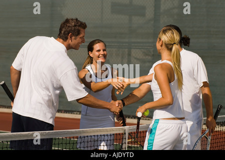 Tennis Players Shaking Hands at Net after tennis match Stock Photo