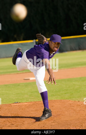 Baseball pitcher throwing ball Stock Photo