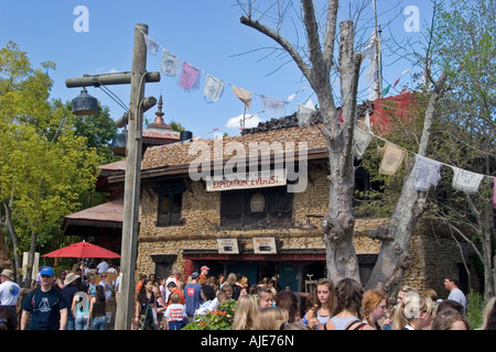 A group of tourist in front of the Expedition Everest attraction ride at Animal Kingdom, Orlando, Florida, USA Stock Photo