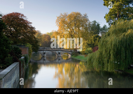 Ancient Clare bridge with autumn colours and reflections bathed in early morning sunlight Stock Photo