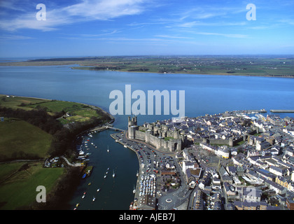Aerial view of Caernarfon town, Castle, Seiont river estuary and Menai Strait Gwynedd Wales UK Stock Photo