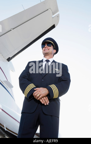 Pilot standing beside his airplane Stock Photo - Alamy