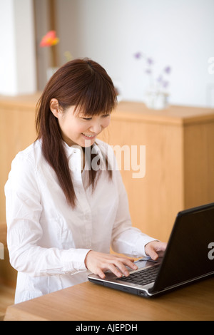 Young woman using computer Stock Photo
