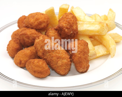 Plate Of Deep Fried Traditional British Scampi and Chips Against A White Background With A Clipping Path And No People Stock Photo
