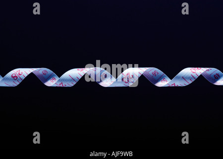 Twisted strip of measuring tape, detail Stock Photo