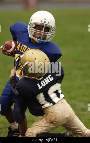 Youth biddy American football action  Stock Photo