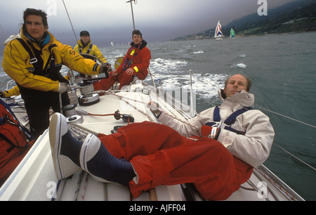 Waterproof Clothing. Yacht sailing racing yachts. Crew in The Round the Island Race race the Isle of Wight England UK 1980s HOMER SYKES Stock Photo