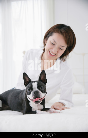 Young woman and Boston Terrier Stock Photo