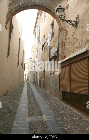 Narrow cobbled street in Alghero, Sardinia, Italy Stock Photo