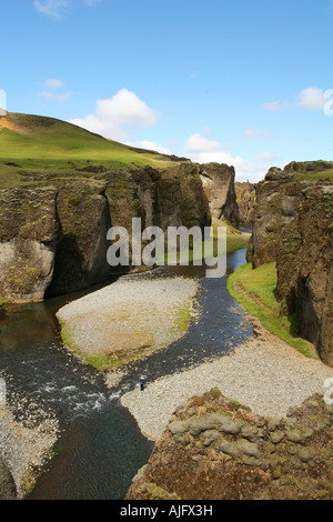 magnificent scenic from over a river canyon in southern Iceland cliffs on all sides and blue sky above Stock Photo